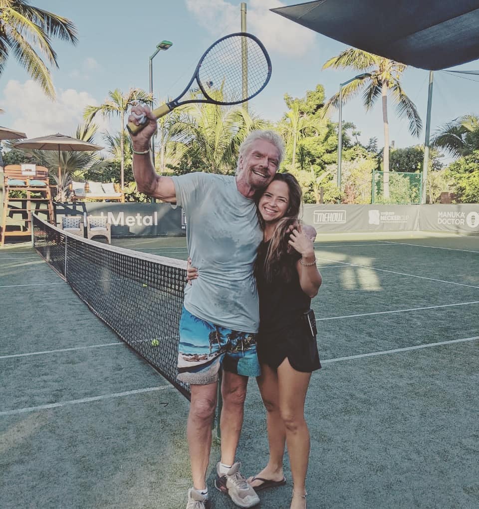 Ronique Redelinghuys with Richard Branson on a tennis court